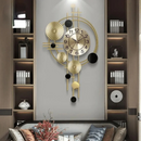 Sculptural Gold Orbit Wall Clock